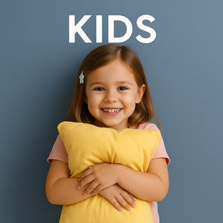 A little girl holding a bamboo cloud technology pillow smiling.
