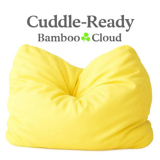 Bright yellow bamboo cloud pillow (16x16x3 inches) with a gathered center, shown on a white background under the text “Cuddle-Ready Bamboo Cloud.”