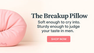 Breakup Pillow in Post-Cry Pretty pink on a neutral background, hero banner with call-to-action “Shop Now”.